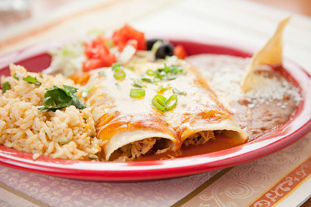 istock Mexican food: beef enchiladas, cilantro rice and refried beans 168443761