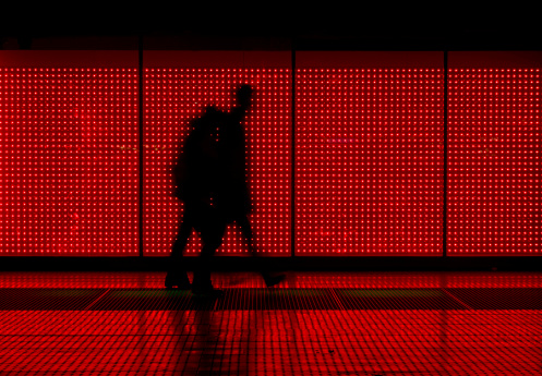 coiuple walking in front of an LED wall