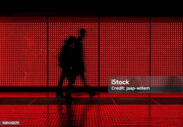 Silhouette Of Man Moving In Red Background Stock Photo - Download Image Now - Red, Abstract, Lighting Equipment