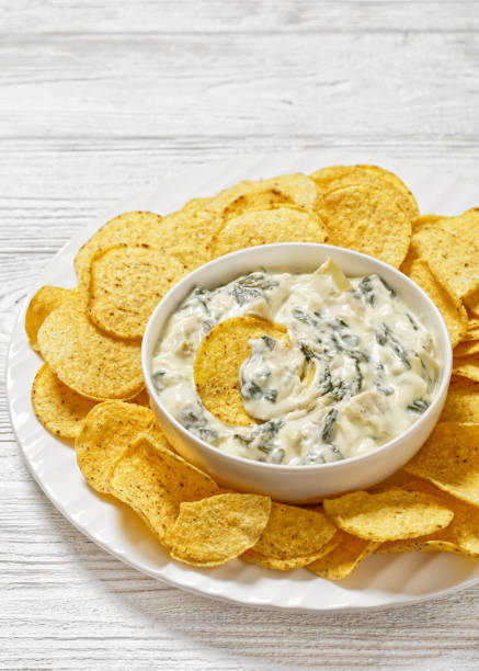 istock artichoke spinach almond dip with potato chips 1684464106