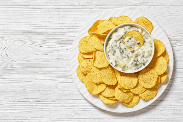 istock artichoke spinach almond dip with potato chips 1684464108