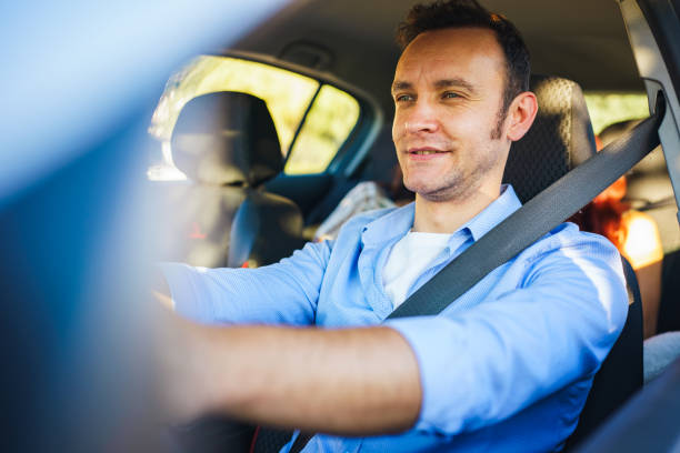 istock Man driving the car with two female passengers 1684464129