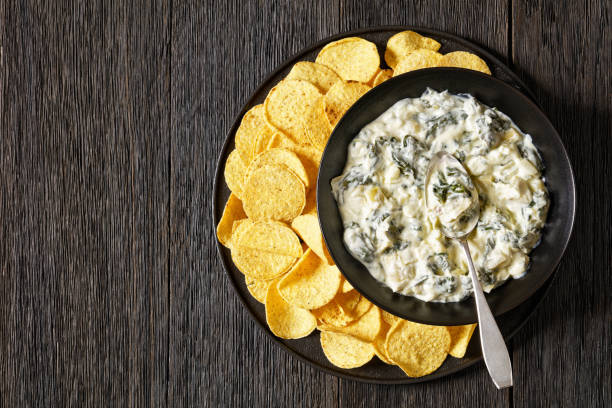 istock artichoke spinach almond dip with potato chips 1684466275