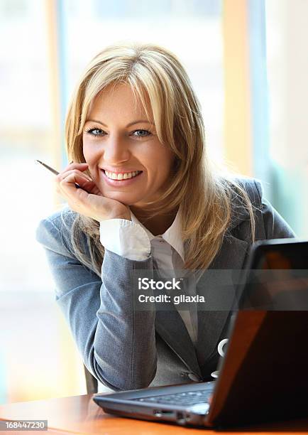 Smiling Businesswoman With Laptop Stock Photo - Download Image Now - 30-39 Years, Adult, Adults Only