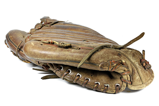 worn baseball glove isolated on white background