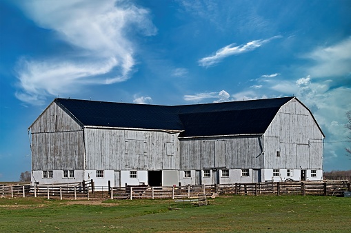 Large Grey Abandoned Barn on a Farm in Rural Canada