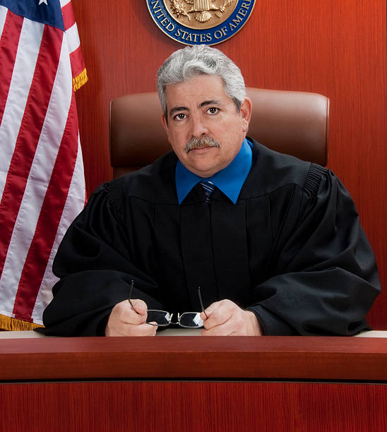 istock Mature judge at the bench with a serious look 168450163