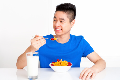 Teenager eating breakfast