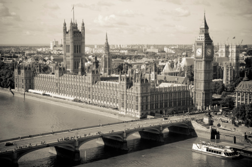 Aerial view of London skyline with St Paul Cathedral on a cloudy day.