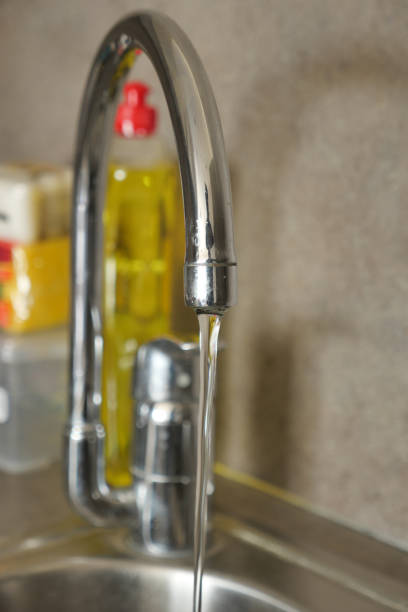 istock water pouring from a faucet tap slow motion 1684510127