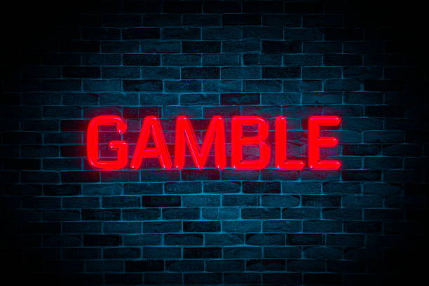 istock Gamble neon banner on brick wall background. 1684528282