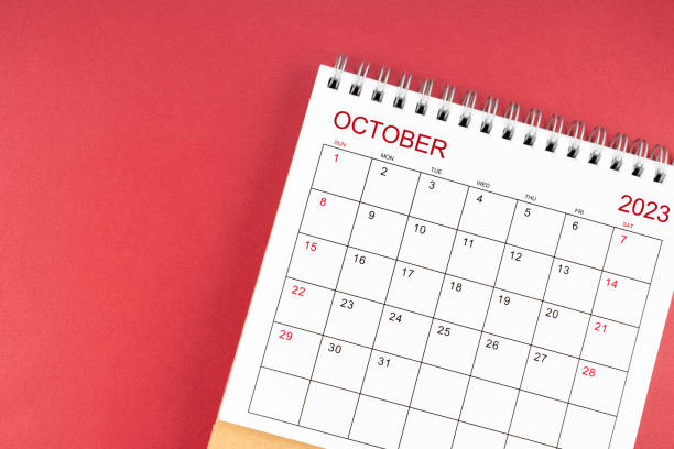 istock The October 2023 desk calendar on red color background. 1684531038