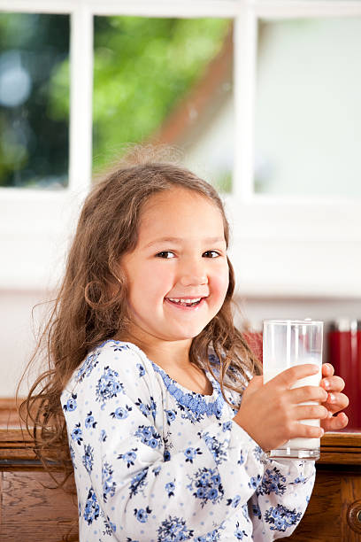 istock Happy girl with milk 168454344