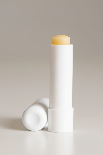 Lip balm packaging mock-up on gray background.