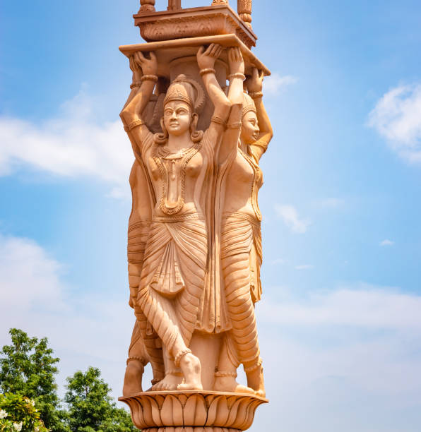 istock artistic red stone jain god holy pillar at morning from unique angle 1684554074