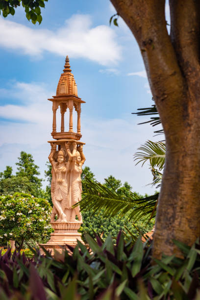 istock artistic red stone jain god holy pillar at morning from unique angle 1684556284