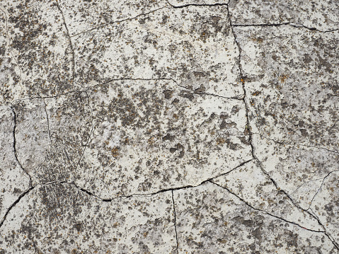 cracked grey concrete texture useful as a background