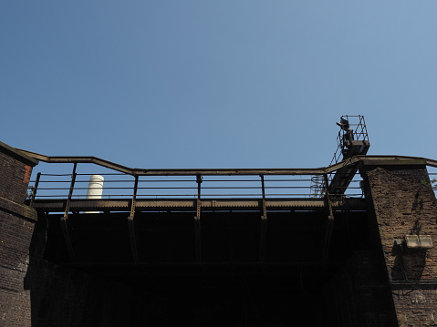 Grosvenor railway bridge over blue sky in London, UK