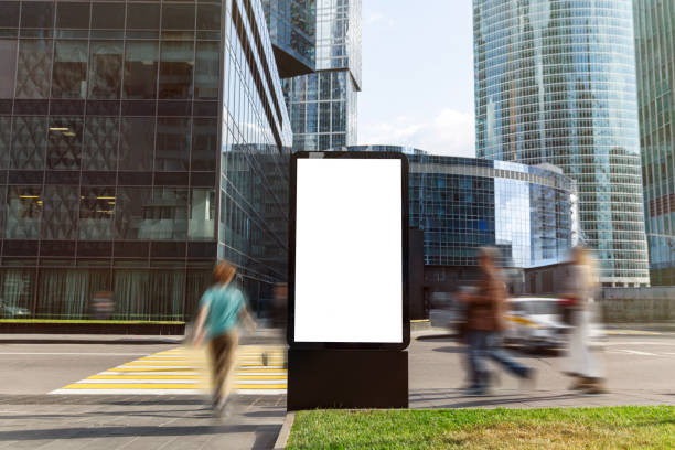 Billboard on the sidewalk by the street. Advertisement with content isolated with white color for copy space