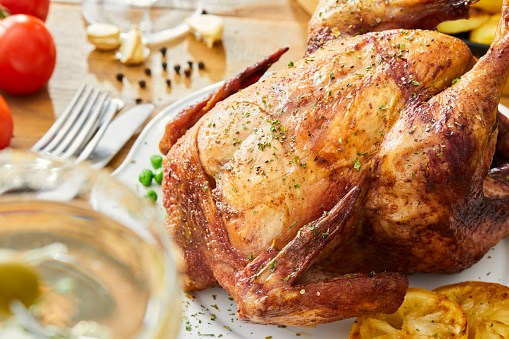 Delicious sliced turkey breast for Thanksgiving Day table on wooden board