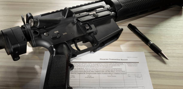 istock Public domain form 4473 and assault rifle 1684624722
