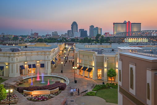 Shreveport, Louisiana, USA downtown city skyline and shopping areas at dusk.