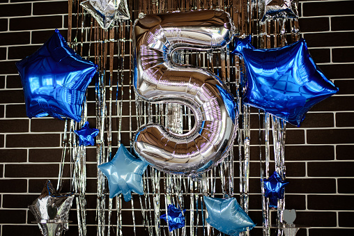 Number 5 of silver air balloon in birthday decoration