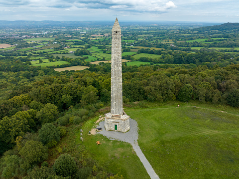 Wellington Monument from the air. Wellington Monument is a 175-foot-high triangular obelisk located on a point of the Blackdown Hills, 3 km south of Wellington in the English county of Somerset