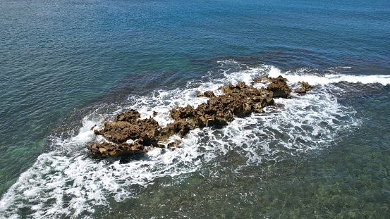 Aerial views of Hawaiian Island beaches, ocean, surf, and geography.