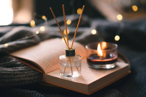 istock Burning candle with book in bed 1684654585