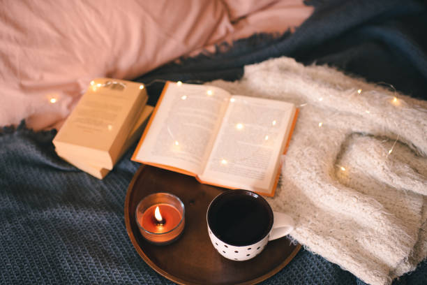 istock Reading in bed with cup of tea in bed 1684654600