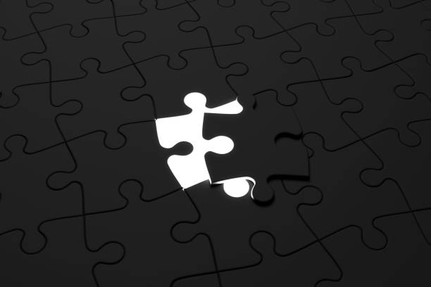 istock Placing last piece black jigsaw puzzle 1684693036