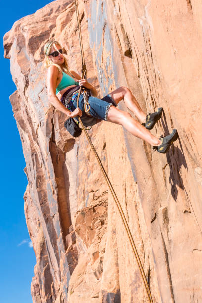 istock Young Woman Rock Climber on a sandstone cliff 168470524