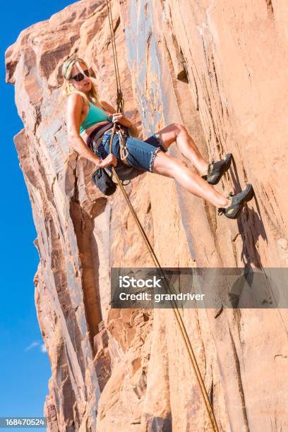 Young Woman Rock Climber On A Sandstone Cliff Stock Photo - Download Image Now - Achievement, Activity, Adult