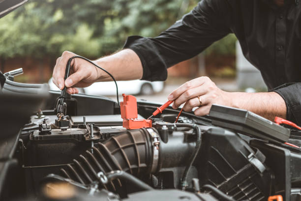 istock Hands check battery car mechanic working in auto repair service 1684708461