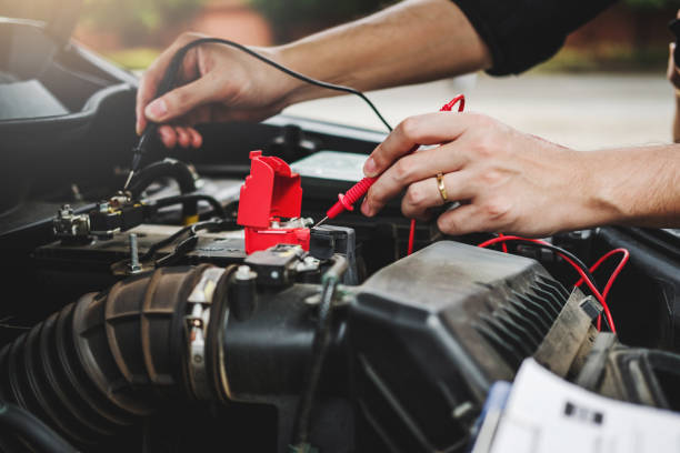 istock Hands check battery car mechanic working in auto repair service 1684708512