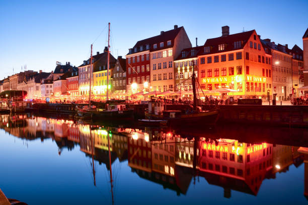 Copenhagen Nyhavn panorama city crowds of people with boats and many small colorful houses