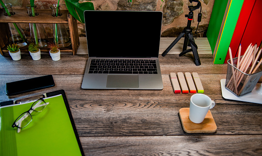 Notebook, Glasses, Coffee, Pencils, Copybooks on the Wooden Table