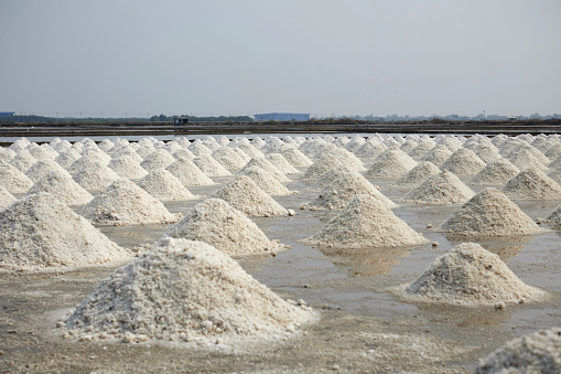 Heap of dried salt at salt pan in Thailand