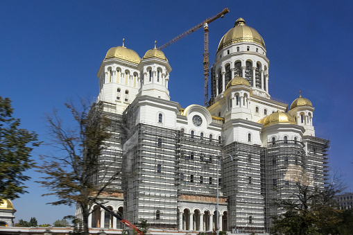Bucharest, Romania - September 12, 2023: Mantuirii Neamului Cathedral under construction in the urban center of the city