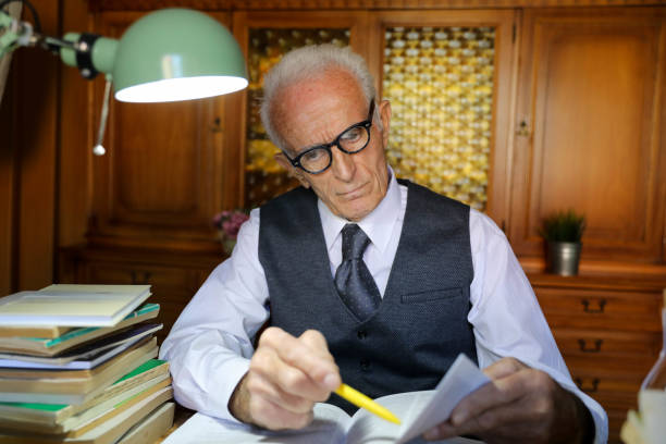 istock Senior businessman reading a document at office 1684723688