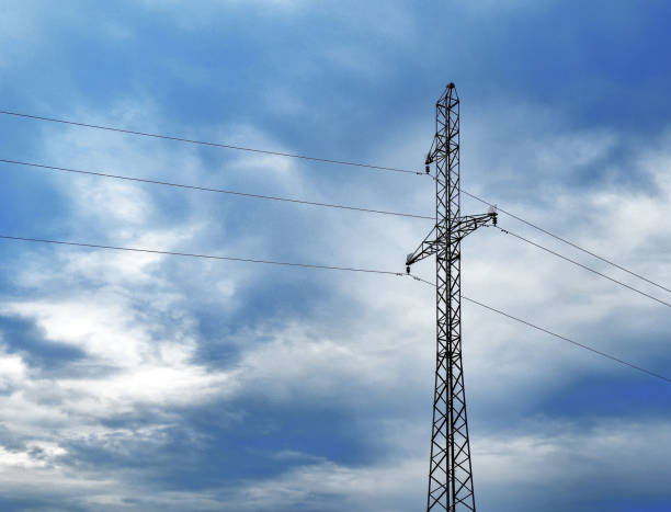 istock Electric power tower, mast with cables over clouded sky background 1684725899