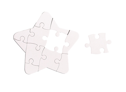Finding solution concept. Missing lacking puzzle piece in star jigsaw isolated on white