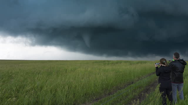 Storm Chaser Adventure Tourists Watch As Tornado Begins To From Close By