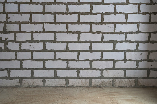 the inner wall of a country cottage. the wall is made of aerated concrete blocks This material also known as gas of foam concrete.. The concept of repair and construction