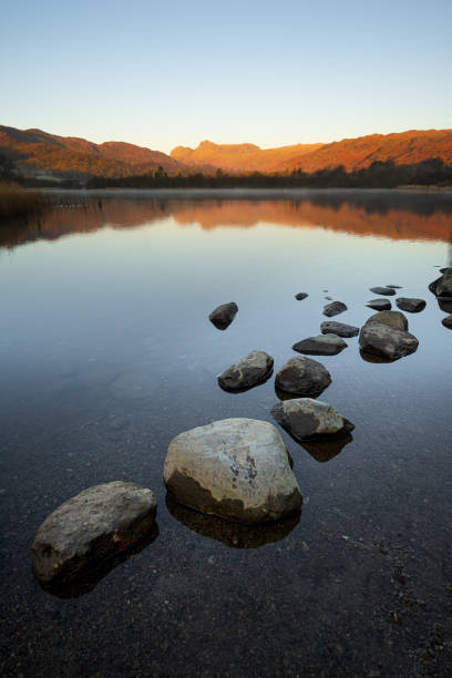 The serene beauty of Blea Tarn, in the little Langdale, with the glorious Langdale Pikes in the background.It has been designated as a site of special scientific interest but you don't need to be a scientist to appreciate its loveliness . The waters of the Tarn teem with perch, pike, and brown trout.