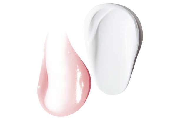 istock A smear of white and pink cream on an empty background. isolated 1684749164