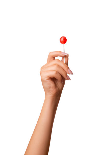 istock A woman's hand holds a lollipop. on isolated transparent background 1684757866