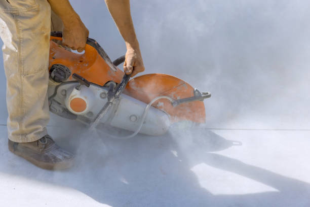 istock Construction Worker Employing Diamond Blade Saw for Concrete Paving Sidewalk Cutting 1684772450