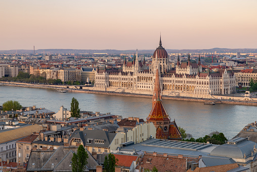 A picture of the Hungarian Parliament Building at sunset.